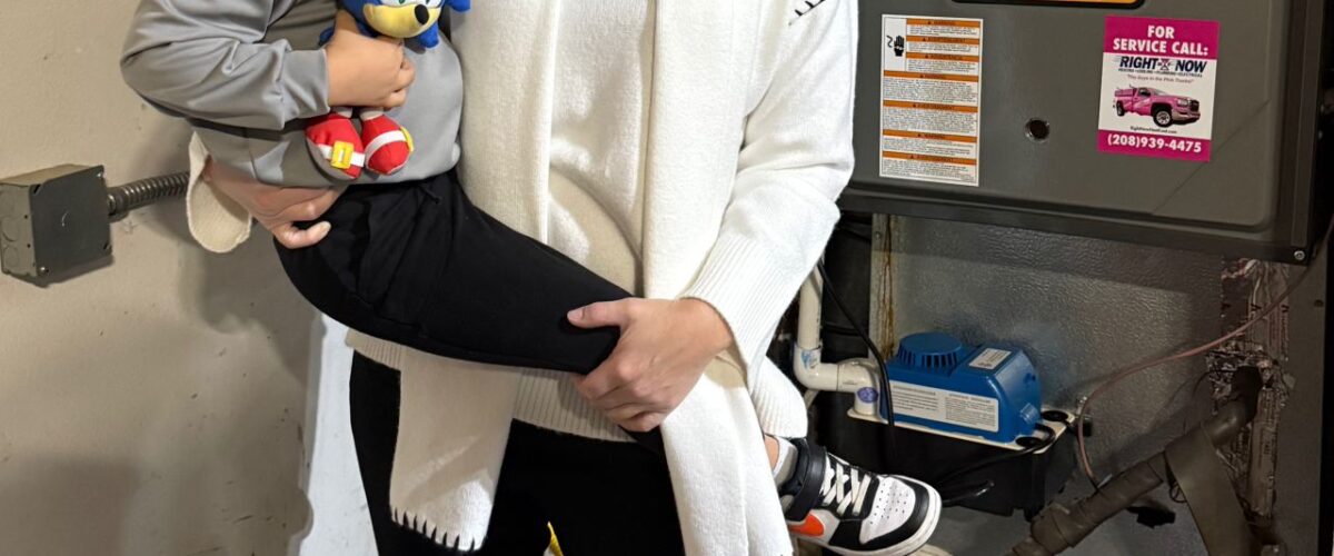 Heather and her son with a new furnace from Right Now